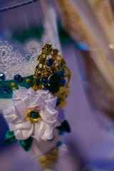 Decor of a wedding glass. Satin ribbon flowers with stones.