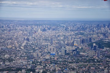 Aerial view of Bangkok Thailand and surrounding landscape, modern office buildings, condominium, living place in Bangkok city downtown in the most populated. Southeast Asia.