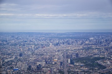 Aerial view of Bangkok Thailand and surrounding landscape, modern office buildings, condominium, living place in Bangkok city downtown in the most populated. Southeast Asia.