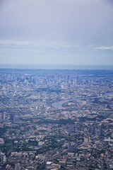 Aerial view of Bangkok Thailand and surrounding landscape, modern office buildings, condominium, living place in Bangkok city downtown in the most populated. Southeast Asia.
