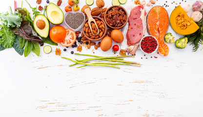 Ketogenic low carbs diet concept. Ingredients for healthy foods selection on white wooden...