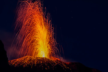 Eruption of the Stromboli volcano with lava streaming on the slopes