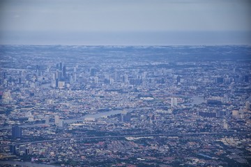 Aerial view of Bangkok Thailand and surrounding landscape, modern office buildings, condominium, living place in Bangkok city downtown in the most populated. Southeast Asia.