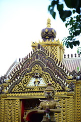 Beautiful thai temple decorated with sculptures an gold