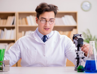 Mad crazy scientist doctor doing experiments in a laboratory