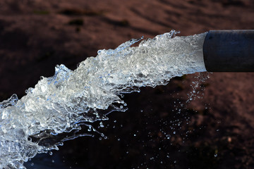 water flow out from pipe by pump supply for dry season	