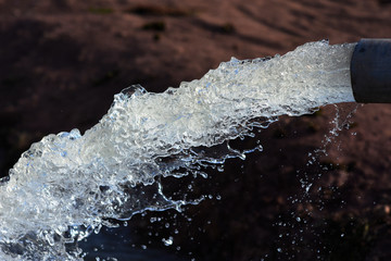 water flow out from pipe by pump supply for dry season	