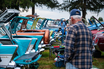 Fototapeta premium 1950s car trunks open at a car show