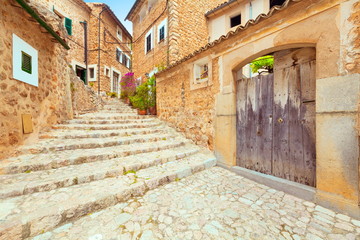 Obraz premium Fornalutx Majorca Spain old romantic historic town village with stone steps and flowers