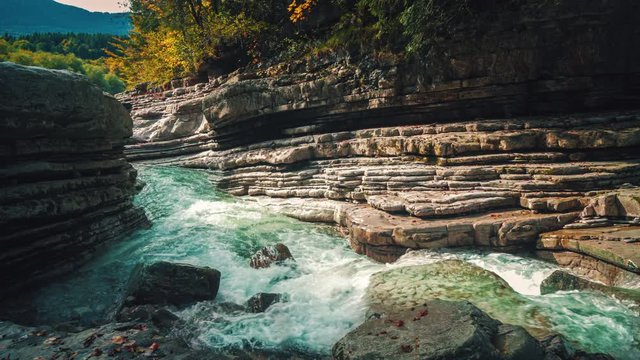4K UHD Cinemagraph / seamless video loop of the mountain river Taugl in Austria, close to Mozart birthplace Salzburg. The water is rushing through naturally formed rocks.