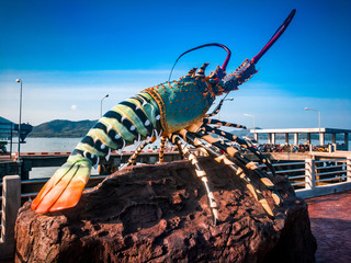 Phuket lobster statue at public pier , Koh yao , Thailand