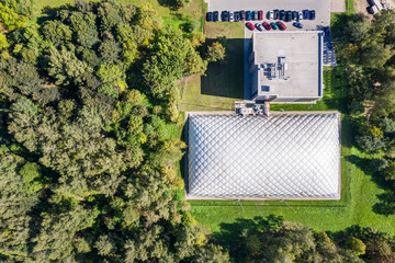 top down view of inflatable tennis court in green summer park. aerial image