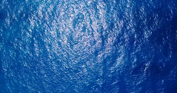 Drone video of blue waves and sailboat in ocean, Thailand