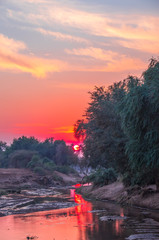 Sunrise over the Luvuvhu river at Pafuri in the Kruger National Park in South Africa image for...