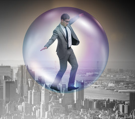 Businessman flying inside the bubble