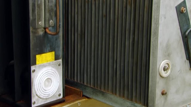Cartridge of electrostatic precipitator purifies air particles at high voltage. Air purification from toxic substances by water grills BBQ indoors restaurants. Cleaning technology concept.