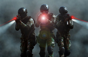 Special force assult team at night with laser sights and smoke screen background