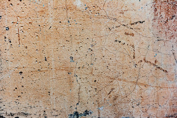 Texture of a concrete wall with cracks and scratches which can be used as a background