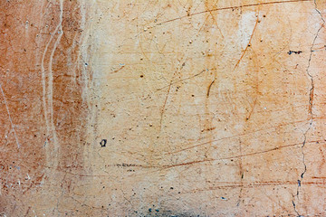 Texture of a concrete wall with cracks and scratches which can be used as a background