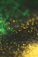 Wallpaper phone shining glitter.New Year and Christmas Festive background. Gold and green glitter...