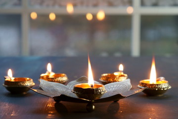 Metal Diyas lit up for the Indian Hindu festival of Diwal