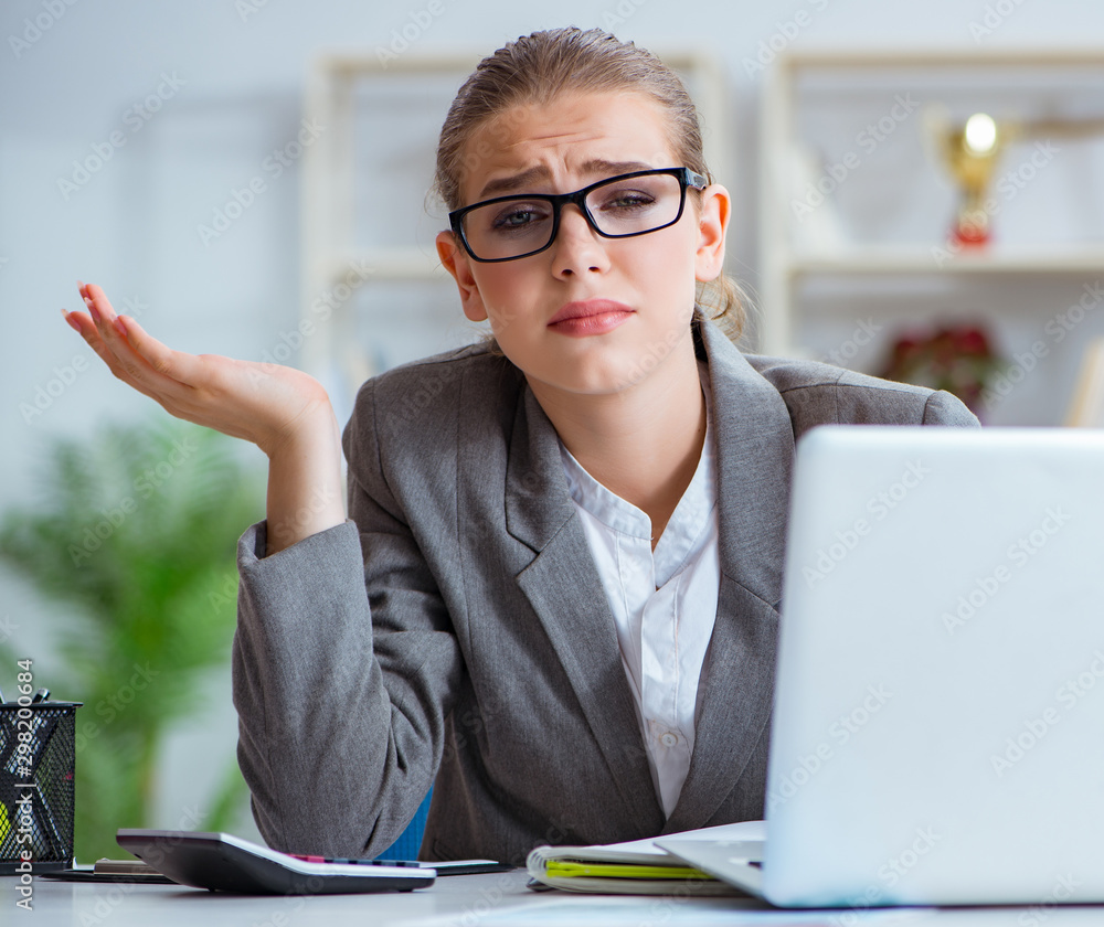 Wall mural Young businesswoman accountant working in the office