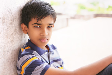 Portrait of Indian boy posing to camera