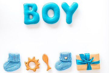 Boy's birthday concept. Set in blue colors with gift box on white backgound top view frame space for text