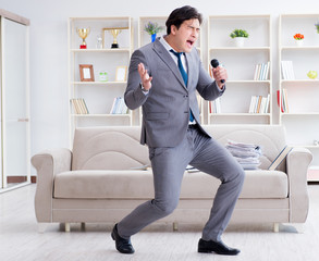 Drunk businessman celebrating in the office