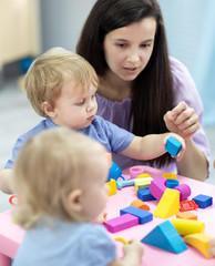 mother and daughter playing with blocks