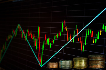 stock chart with coin stack
