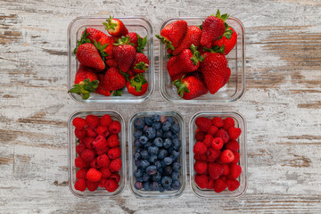 fresh healthy berries in containers