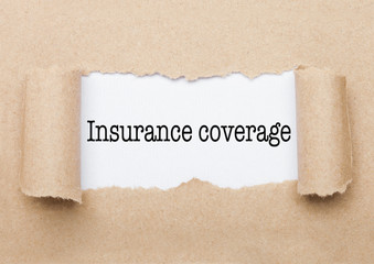 Insurance coverage text appearing behind paper