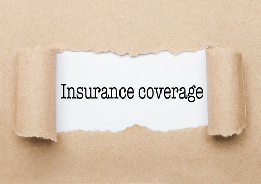 Insurance Coverage Text Appearing Behind Paper
