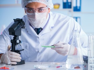 Female scientist researcher conducting an experiment in a labora