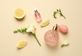 Flat lay composition with elegant perfume on beige background