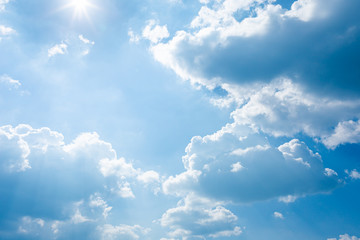 Naklejka na ściany i meble blue sky and bright clouds with the sun shining