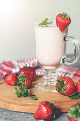strawberry smoothie with mint on the table, front view