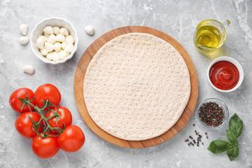 Flat lay composition with fresh ingredients for pizza Margherita on marble table