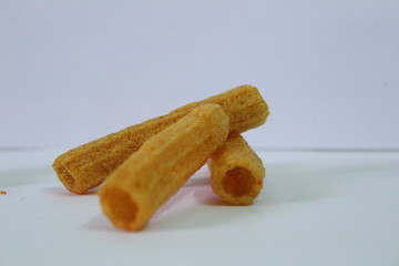 closeup shot of crispy fried roll pappad snacks with white background
