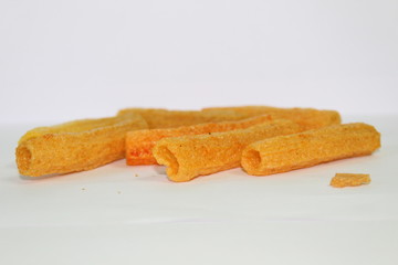 closeup shot of crispy fried roll pappad snacks with white background