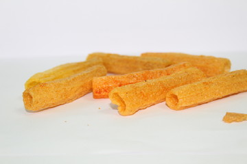 closeup shot of crispy fried roll pappad snacks with white background