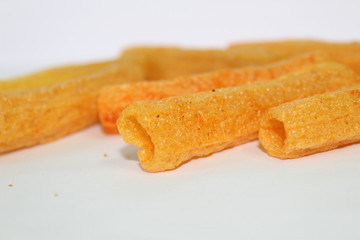 closeup shot of crispy fried roll pappad snacks with white background