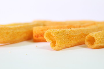 closeup shot of crispy fried roll pappad snacks with white background