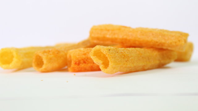 closeup shot of crispy fried roll pappad snacks with white background