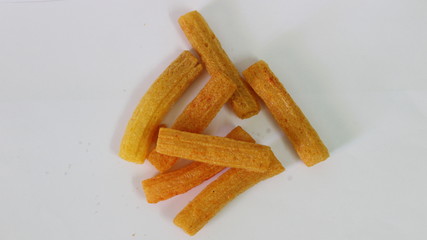 closeup shot of crispy fried roll pappad snacks with white background