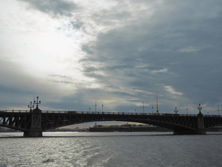 Landscape with Troitskiy Bridge and the Peter and Paul fortress on stormy day. Neva river, Saint-Petersburg. Selective focus.