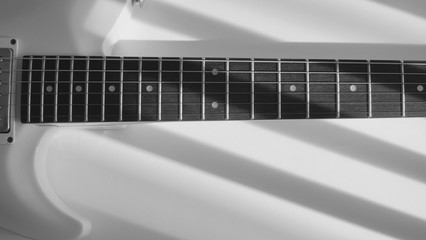 white guitar closeup . white background