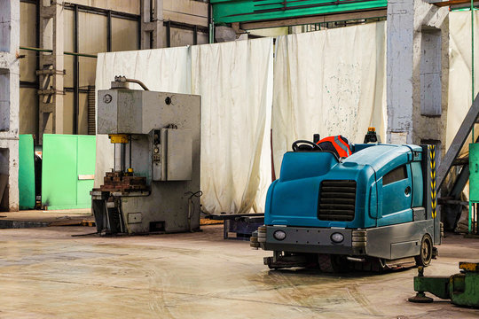 Floor Sweeper And Washer Scrubber Drier Car In An Industrial Building Engineering Workshop