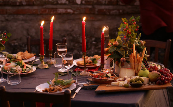 festive autumn table setting with fruits and cheese